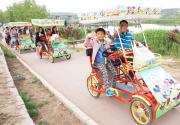 石景山“莲石湖亲子游”线路开通 乘坐卡通自行车沿湖骑行